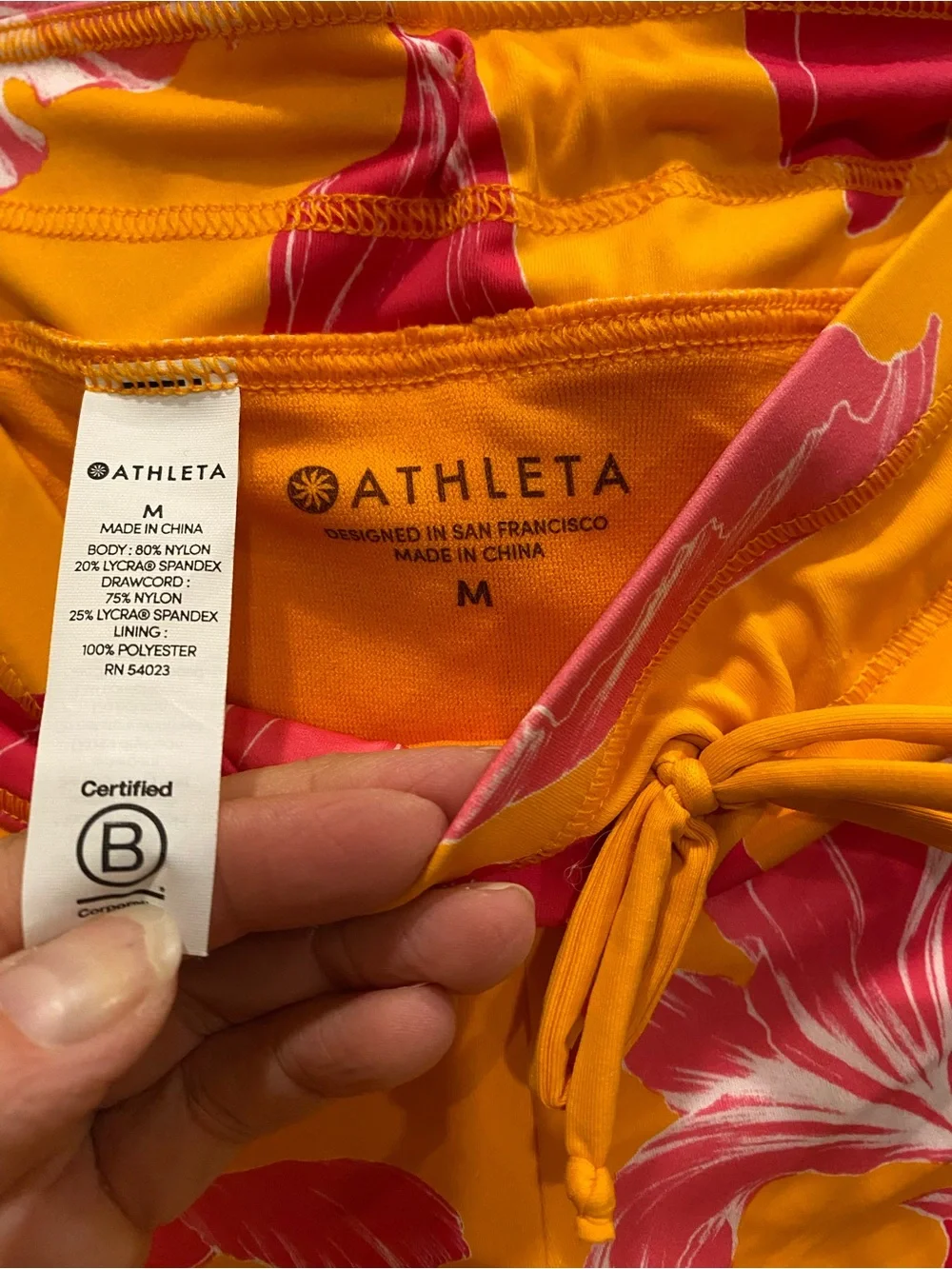 Athleta Yellow Athletic Shorts with Pink Floral Design